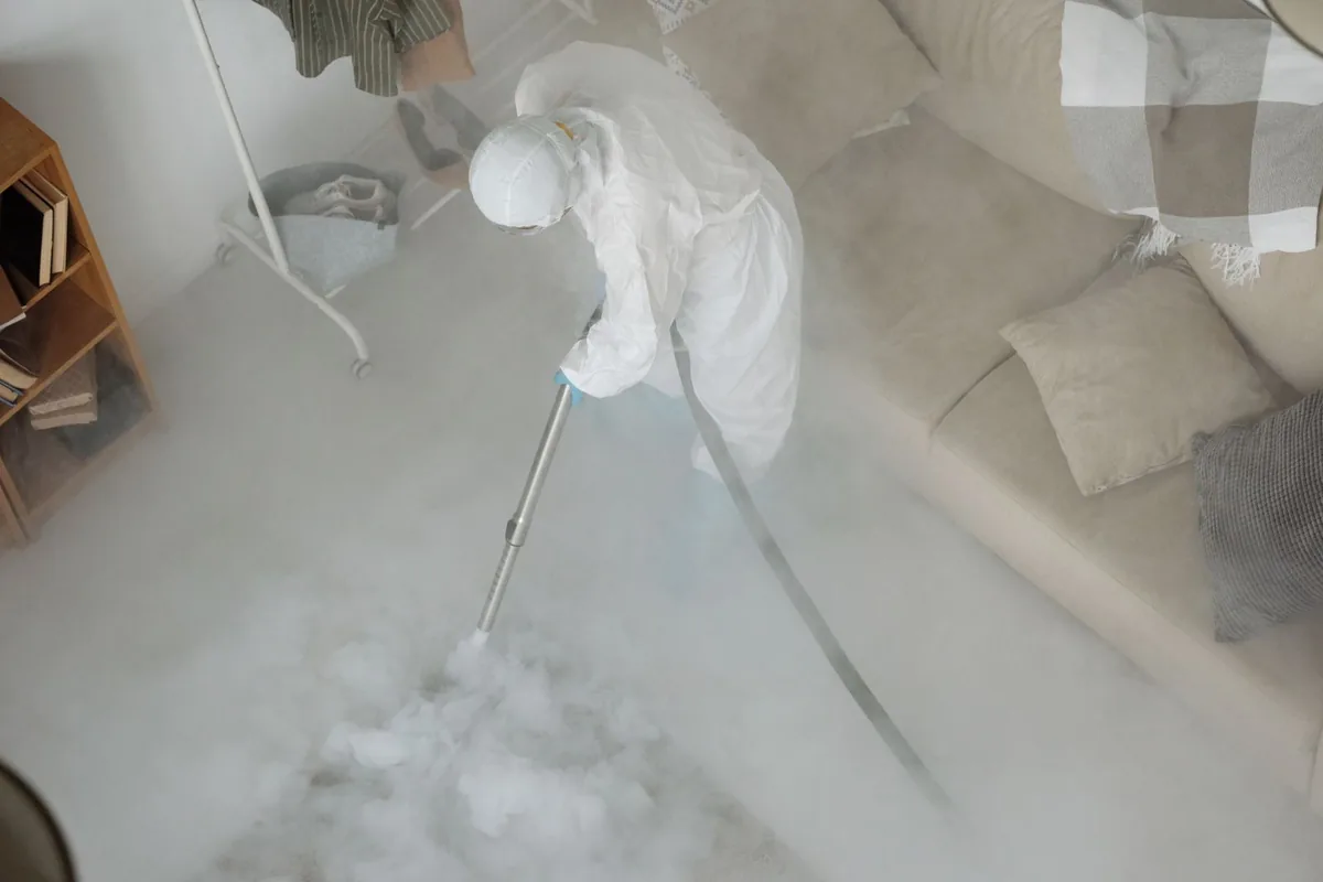 Biohazard cleanup technician in protective equipment, Rosedale, WA